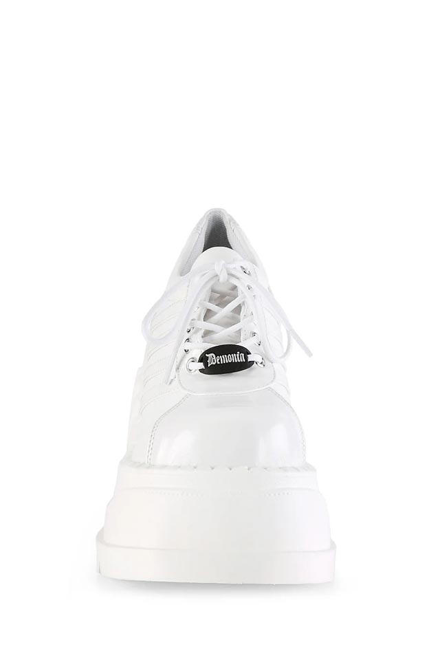 Белые кроссовки на высокой платформе Demonia